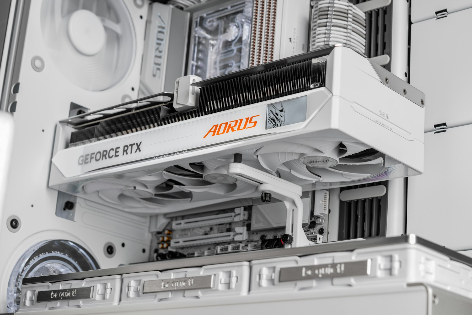 Close-up of a white graphics card inside a luxury PC build